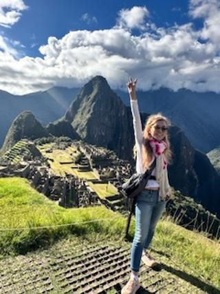 How to expand your mind traveling picture showing me in Machu Picchu
